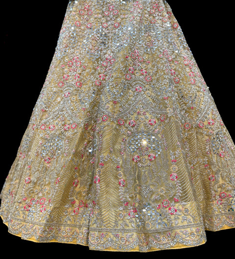 (Video clip attached)Gold colour netting Based Beautiful Embroidery & Mirror Work With Golden Fine Stones& beaded work Very Heavy Layered Designer semi/Bridal Lehnga With Heavy Tessels Attached To Blouse & Lehnga