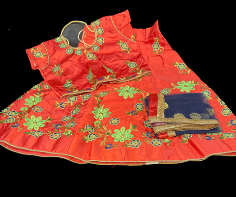 Deep Peachy Pink  colour silk based embroidered lehnga with contrast netting dupatta