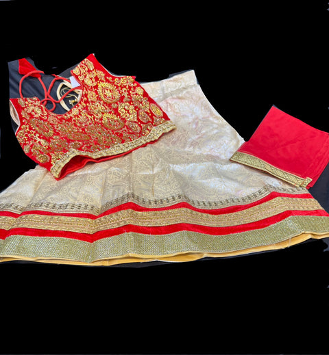 Dark Maroon colour velvet based blouse with embroidery & Stone work with golden brocade silk Lehnga & netting dupatta
