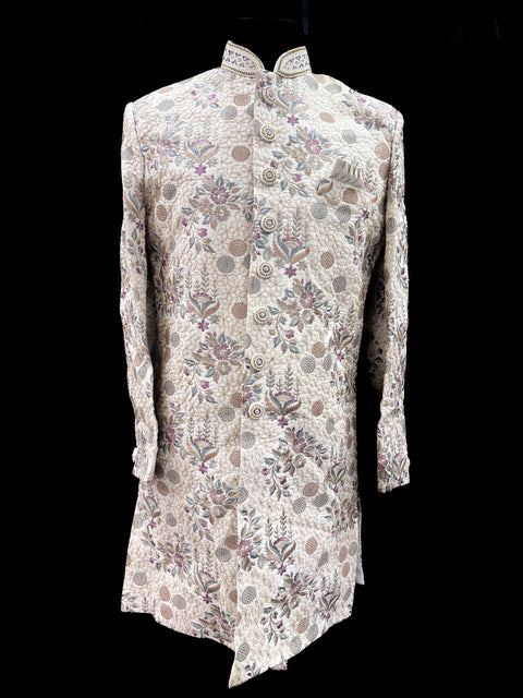 (Video clip attached )Cream gold beige based heavy embroidery & pearl sequined work all over with hand work pearl beaded neck, buttons and sleeves design Sherwani and Pants