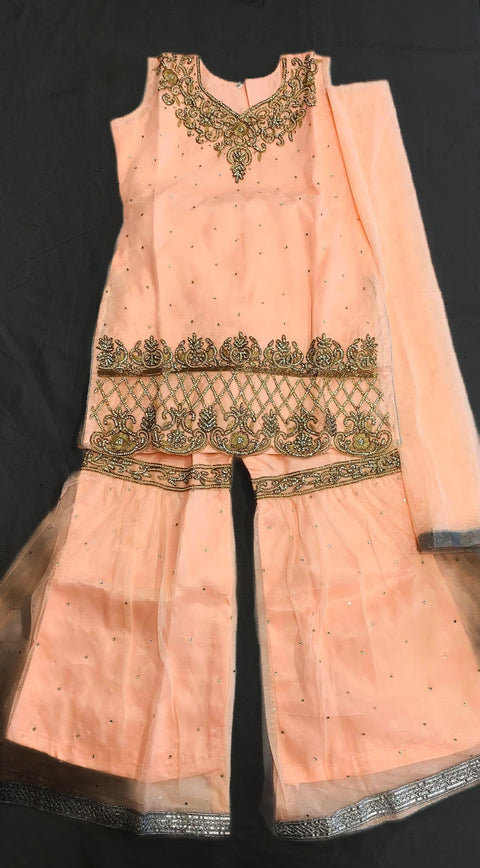 Peach color netting based stone work kids Sharara suit