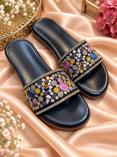 Black flats with colourful thread embroidery and delicate embellishment detail. Soft, stylish and perfect for casual, festive and everyday wear.