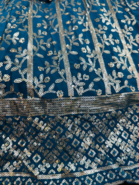 All over embroidery with sequined work heavy design crop top blouse with heavy work multiflared lehnga and netting dupatta