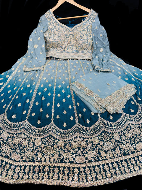 Chinnon based embroidery with mirror work designer blouse with ombré tone lehnga and netting based sequined work dupatta