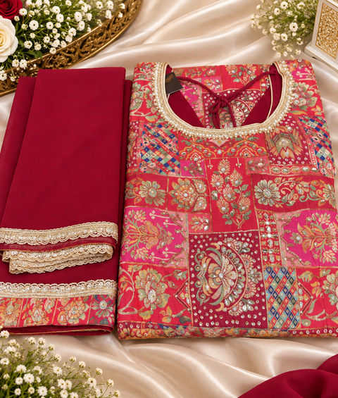 Silk-blend patchwork kameez with mirror & stone work, paired with a flowy circular palazzo and plain georgette dupatta with golden border. Slight variation in colour/design possible