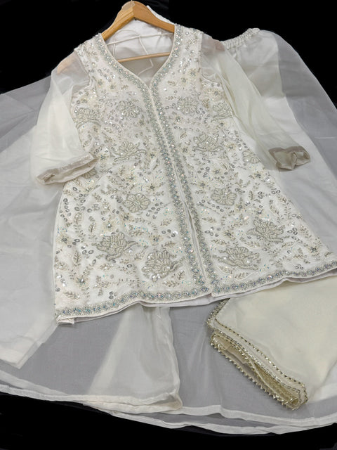 (Video clip attached) Cream color georgette based heavy hand work pearl beaded work with big flared plazo and georgette dupatta (size 38 and can be altered upto 40)