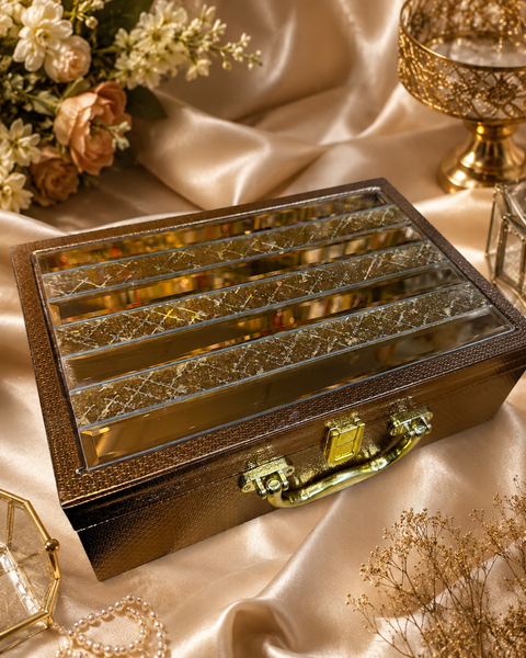 Beautiful mirror-work bangle box with a rich red interior and 3 spacious rows. Bangles are not included and are shown for display only. Fill it with your own bangles or shop our beautiful bangle collection online.
Approx. Size: 34 × 25 × 9.5 cm.
