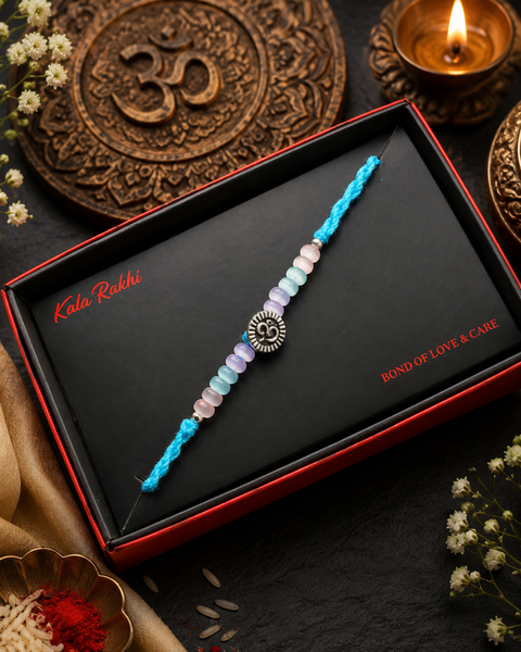 Beautiful Small Om Rakhi featuring a spiritual centrepiece, Rudraksha beads and elegant gold accents. A meaningful choice to celebrate Raksha Bandhan with blessings, love and tradition.
