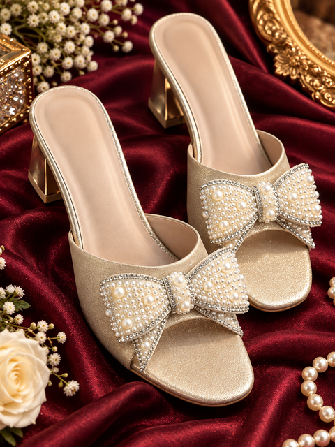 Elegant gold-tone heels featuring a statement pearl bow with delicate stone detailing. Stylish, comfortable and perfect for weddings, parties and festive wear.