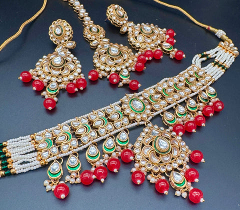 Beautiful Kundan and pearls work classy choker set with beautiful earrings & Tikka