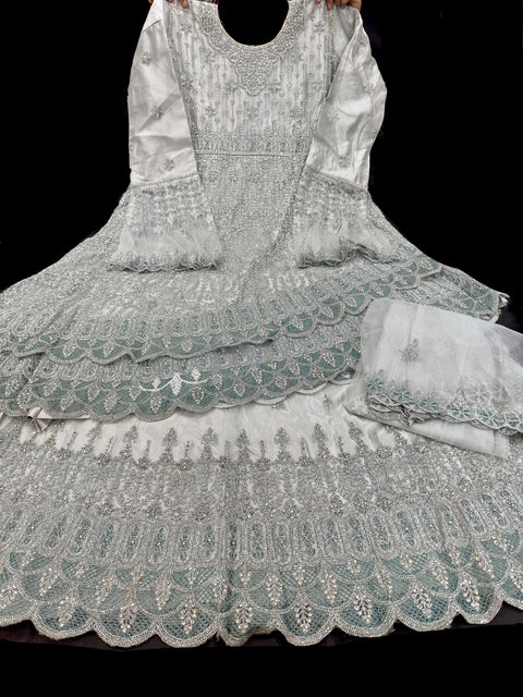 Netting based silver stones and embroidery work all over front & back of kameez with stone work and beautiful lehnga & netting dupatta (Size 44 and can be altered upto 46)