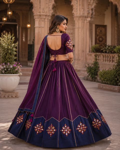 A stunning handcrafted Navratri Lehenga adorned with colourful embroidered patchwork, mirror work, delicate seashell detailing, and a beautifully flared silhouette—perfect for festive celebrations(slight variation in color and design is possible)