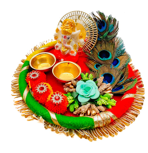 Beautiful Ganesha Murti decorated in plate with peacock feather and Jyoti stand attached