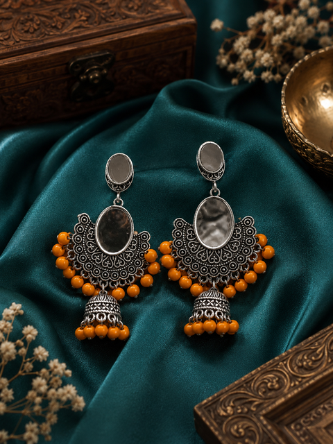 Oxidised earrings with orange pearls