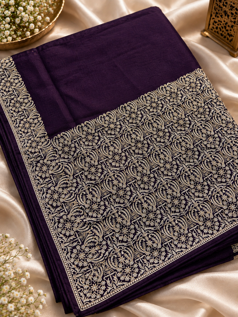 Soft-flowing fancy silk georgette saree with elegant embroidered borders, fine stone work and a heavy detailed pallu. Includes an attached embroidered blouse piece; model blouse is for reference only. Slight variation in colour/design possible.