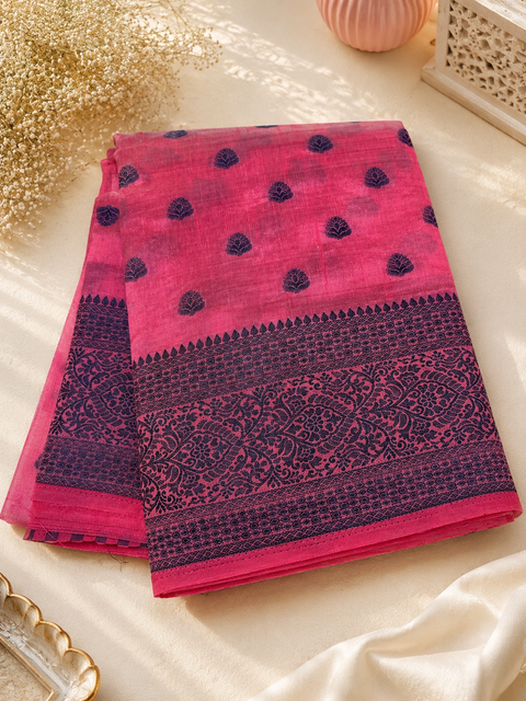 Beautiful semi-silk cotton saree with an elegant woven border and classic motifs. Attached blouse piece included. Slight variation in colour and design may occur.