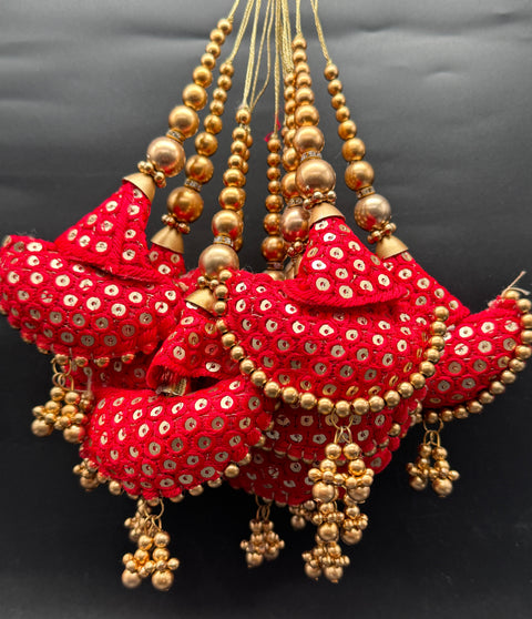 Beautiful cushioned design medium size lehnga latkans tessels (pair)