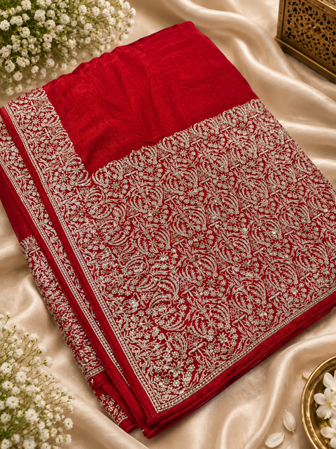 Soft-flowing fancy silk georgette saree with elegant embroidered borders, fine stone work and a heavy detailed pallu. Includes an attached embroidered blouse piece; model blouse is for reference only. Slight variation in colour/design possible.
