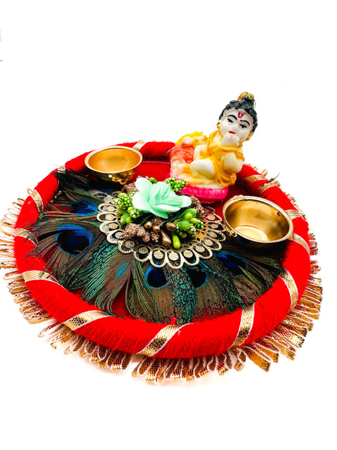 Beautiful Krishna Murti decorated in plate with peacock feather and Jyoti stand attached