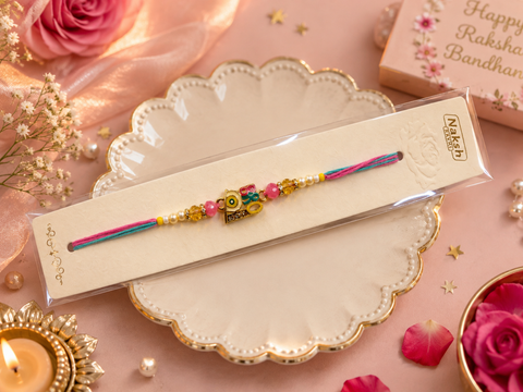 Evil eye Elegant handcrafted Rakhi with premium beads and sparkling stonework, beautifully crafted to celebrate the special bond of love and protection.