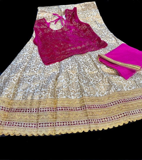 Red colour velvet based stone work blouse with golden colour brocade silk based lehnga