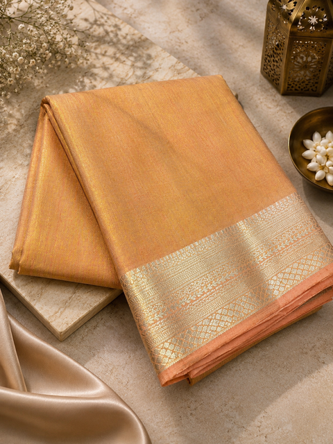 Soft Silk Tissue Saree with Dual Tone Metallic Finish .Model-worn blouse is for reference only. Unstitched blouse piece is attached with saree(slight variation in color & design is possible)