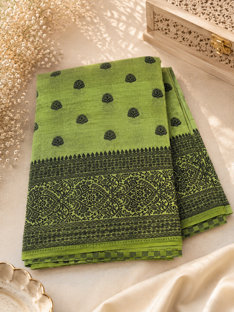 Beautiful semi-silk cotton saree with an elegant woven border and classic motifs. Attached blouse piece included. Slight variation in colour and design may occur.