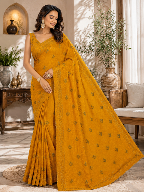 Beautiful Shimmery Georgette Saree featuring elegant embroidery and stone work throughout. Comes with an unstitched matching blouse piece. Model blouse is for reference purpose only. Slight colour and design variations may occur.