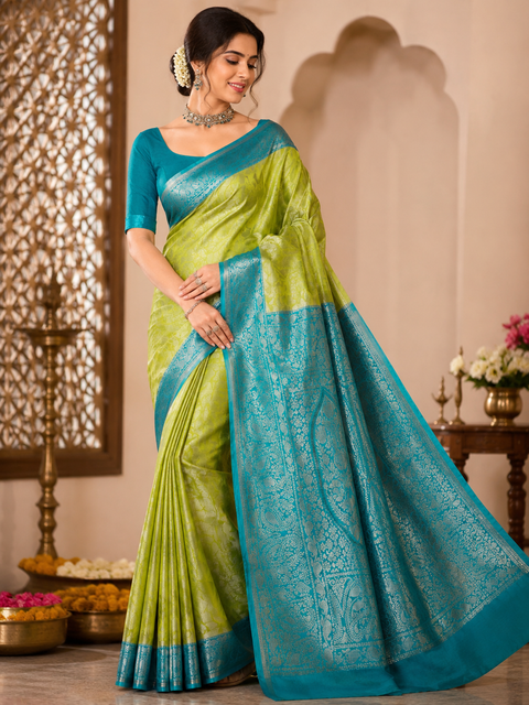 Premium South Silk Saree with rich zari weaving and contrast woven pallu. featuring elegant dual-tone shades.Model-worn blouse is for reference only. Unstitched blouse piece is attached with saree(slight variation in color & design is possible)