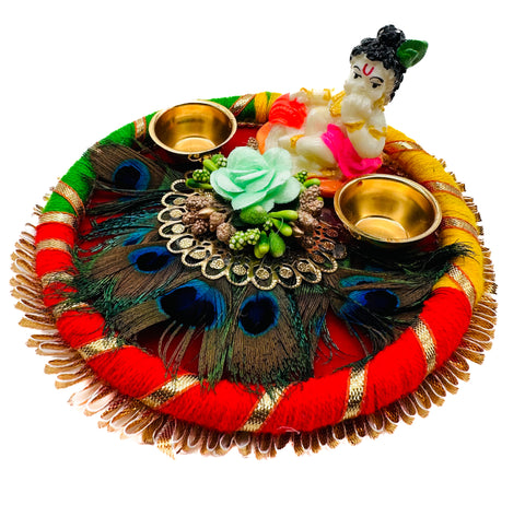 Beautiful Krishna Murti decorated in plate with peacock feather and Jyoti stand attached