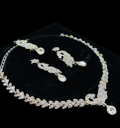 Silver color Jerkan stone studded beautiful necklace set with Earrings & Tikka