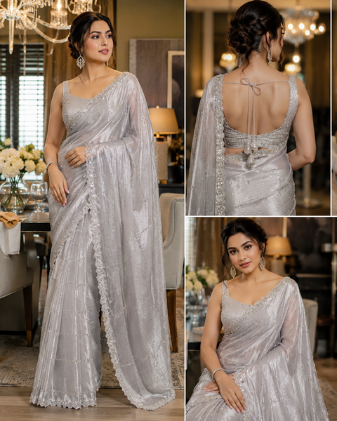 Elegant Jimmy Choo Saree featuring intricate handwork detailing and a beautifully embellished border. Comes with an attached matching blouse piece, blouse worn by the model is for reference purposes only(slight variation in color and design is possible)