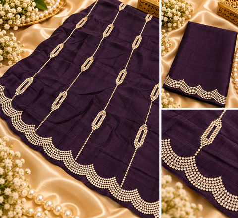 Soft Shiny Georgette Saree with a beautiful flowy drape, elegant stonework lines and a rich scalloped stone border. Attached blouse piece included; model blouse is for reference only. Slight variation in colour and design is possible.