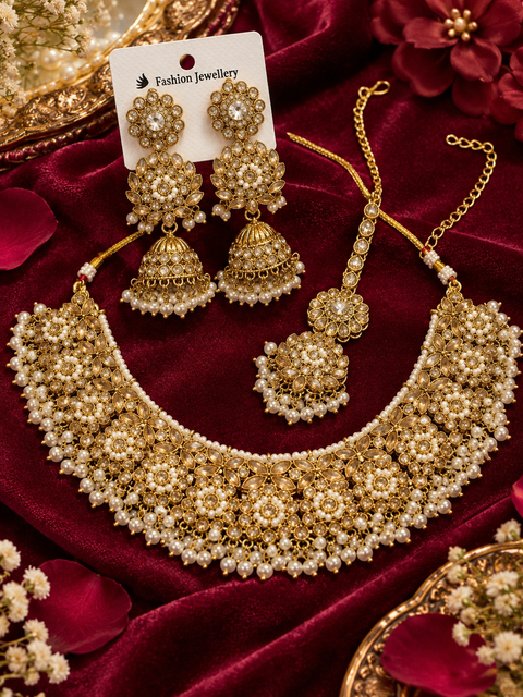 Beautifully crafted with sparkling golden stones, Polki-look stones, and colourful beads. Slight variations in colour and design are possible.