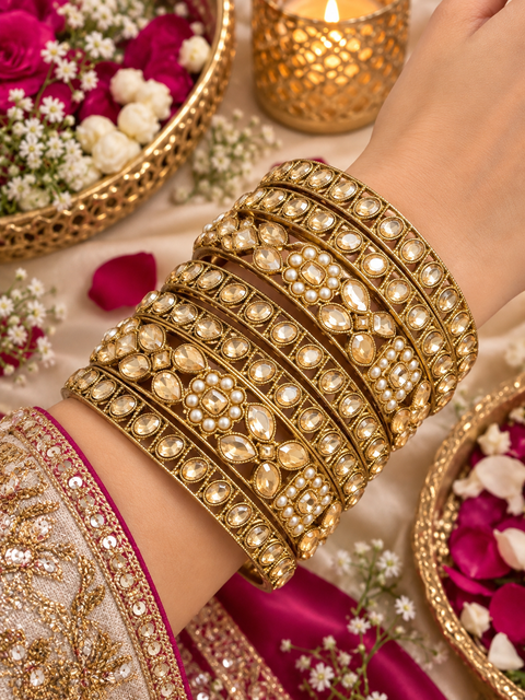 Beautiful bangle set featuring sparkling polki stones (Slight variations in color & design is possible )
