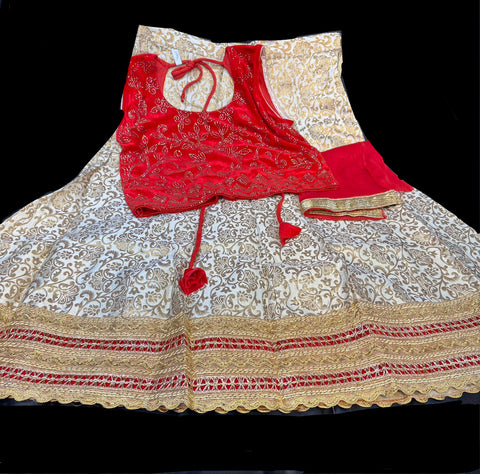 Red colour velvet based stone work blouse with golden colour brocade silk based lehnga