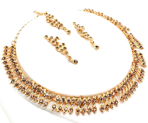 Golden color Jerkan stone studded beautiful necklace set with Earrings & Tikka