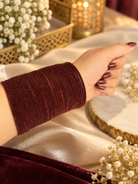 Elegant velvet bangles in a rich Dark Brown shade, perfect for festive, bridal and traditional looks. Each pack includes 3 dozen bangles (36 pieces). Price is per pack. Slight variation in colour may be possible