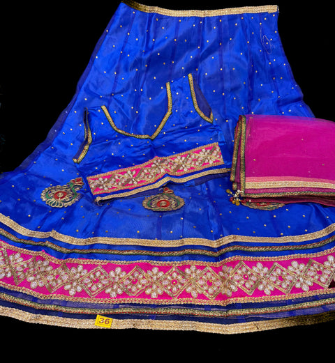 Blue colour netting based embroidery lehnga with Hot Pink colour netting dupatta