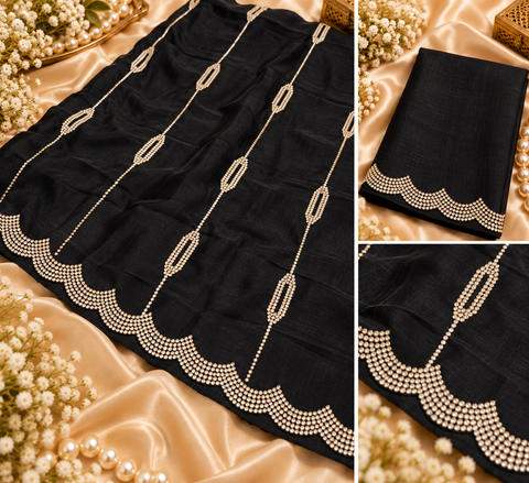 Soft Shiny Georgette Saree with a beautiful flowy drape, elegant stonework lines and a rich scalloped stone border. Attached blouse piece included; model blouse is for reference only. Slight variation in colour and design is possible.