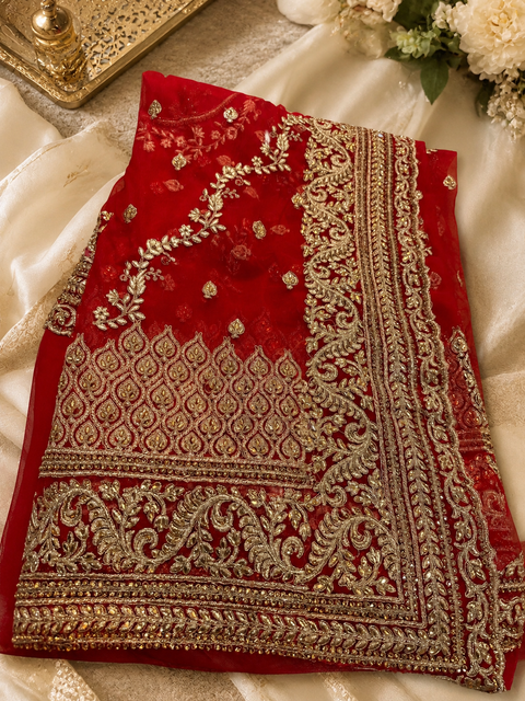 Red Heavy work designer Saree with netting base fabric and stones work design all over with heavy embroidery.The Blouse Worn By The Model Is For Reference Purposes Only. The Actual Blouse Piece Comes Attached With Saree(Slight Variations Are Possible)