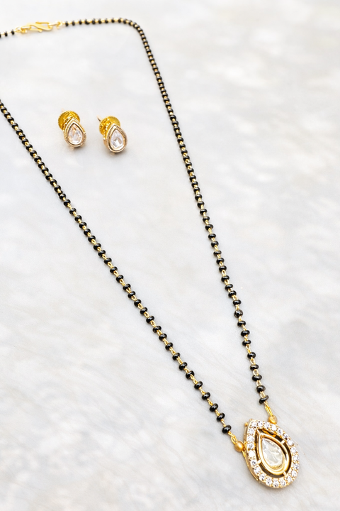 Golden Stone & Jerkan Gold Plated (Artificial) Mangalsutra With Artificial Black Beads Chain, and matching small studs Apx Size: 20-22cm