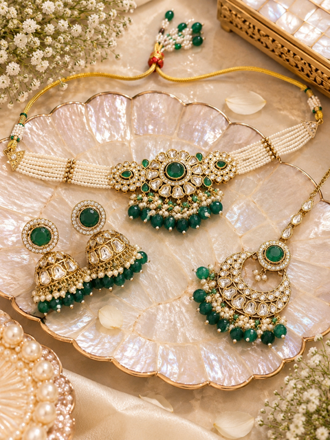 Beautiful Kundan stones with pearls and colorful stones choker necklace & Jhumka with Tikka. Slight variations in colour and design are possible.