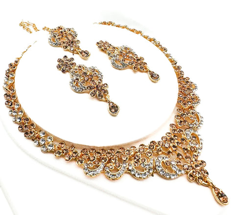 Golden color Jerkan stone studded beautiful necklace set with Earrings & Tikka