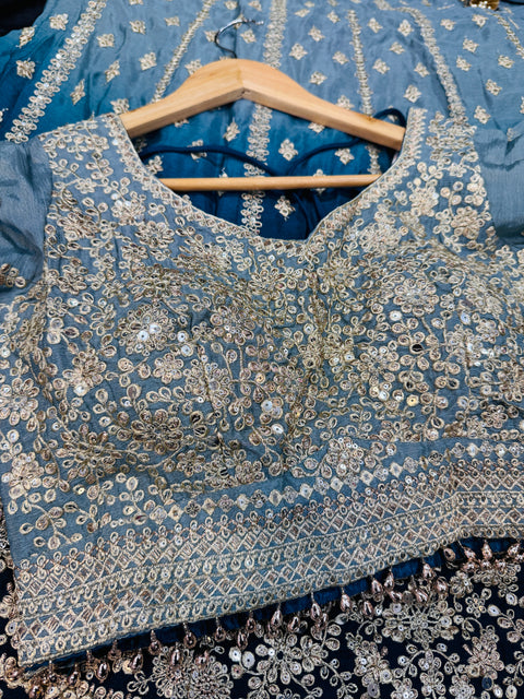 Chinnon based embroidery with mirror work designer blouse with ombré tone lehnga and netting based sequined work dupatta