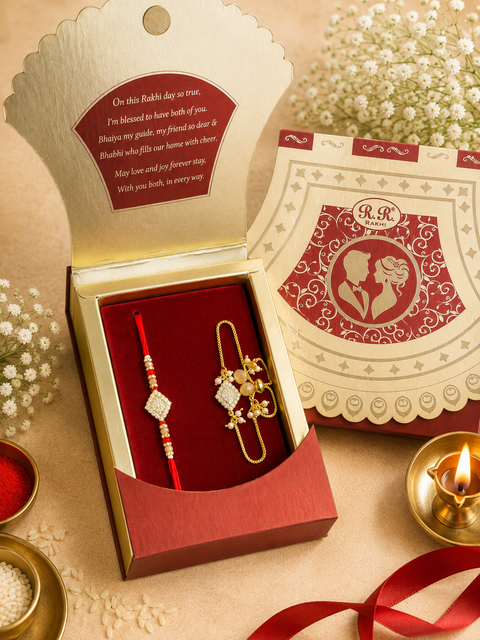 Beautiful Bhai-Bhabhi Rakhi Set featuring an elegant Rakhi, beautifully packed in a festive gift box. A perfect way to celebrate the special bond of Raksha Bandhan with love and blessings.