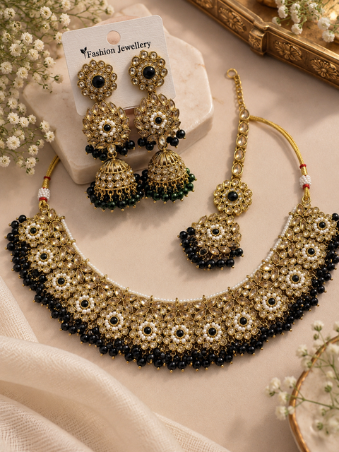 Beautifully crafted with sparkling golden stones, Polki-look stones, and colourful beads. Slight variations in colour and design are possible.