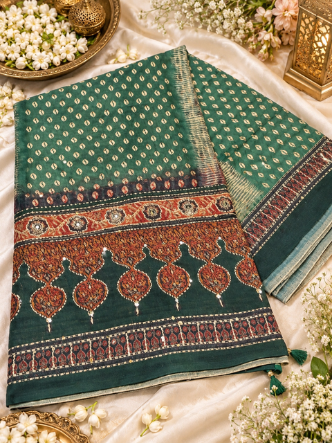 Elegant Chanderi cotton silk saree featuring delicate dotted prints, a beautifully detailed floral pallu and traditional printed border. Lightweight, graceful and perfect for festive or elegant day wear.