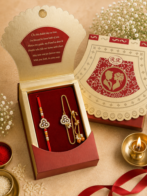 Beautiful Bhai-Bhabhi Rakhi Set featuring an elegant Rakhi, beautifully packed in a festive gift box. A perfect way to celebrate the special bond of Raksha Bandhan with love and blessings.