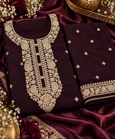 Georgette Silk suit set featuring elegant golden embroidery on the neckline, sleeves and hem, paired with matching pants and a beautifully bordered dupatta.Slight variation in colour and design may be possible.